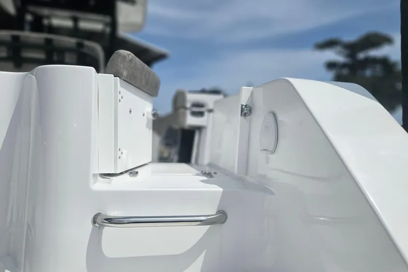 Slide: The Image of 2025 Sea Hunt Gamefish 27 Forward Seating boat detail, showcasing sleek white design and seating. - 7