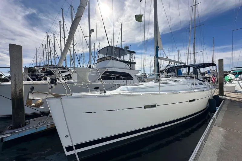 Slide: The Image of 2005 Beneteau Oceanis Clipper 373 sailboat docked at marina under blue sky. - 0