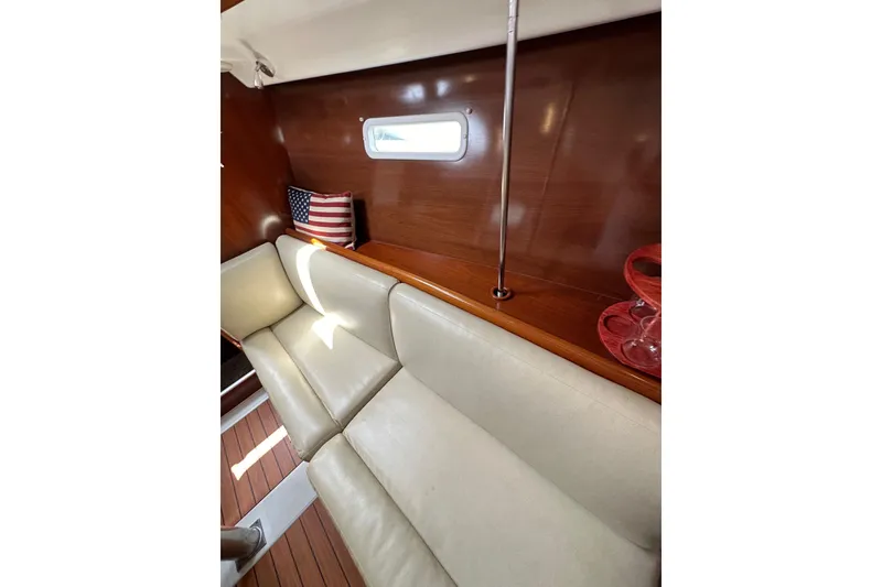 Slide: The Image of Interior of 2005 Beneteau Oceanis Clipper 373 with beige seating and wooden paneling. - 22