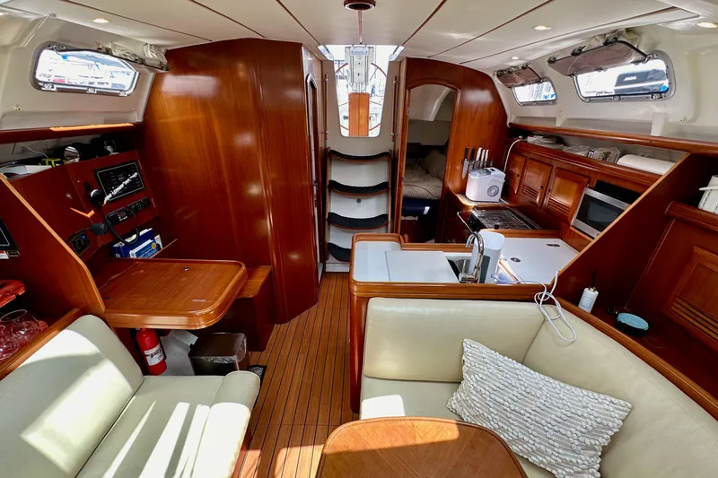 Slide: The Image of Interior of 2005 Beneteau Oceanis Clipper 373 yacht with wood finish and modern amenities. - 23