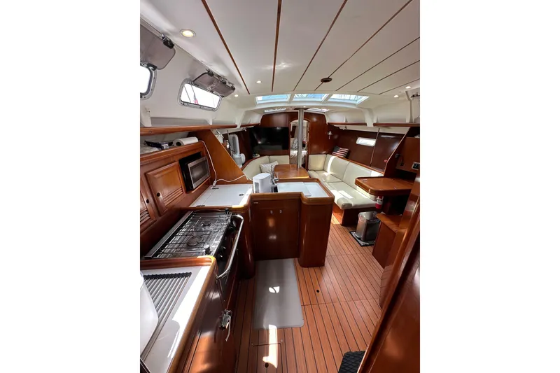 Slide: The Image of Interior of 2005 Beneteau Oceanis Clipper 373 yacht with wood finish and modern amenities. - 27