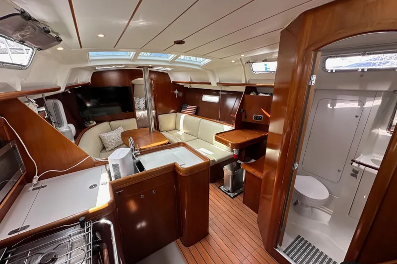Slide: The Image of Luxurious interior of 2005 Beneteau Oceanis Clipper 373 yacht, featuring wood finishes and modern amenities. - 28