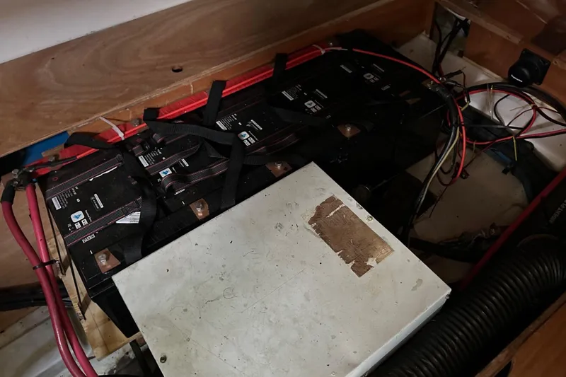 Slide: The Image of Battery compartment of a 2005 Beneteau Oceanis Clipper 373 sailboat, showing wiring and connections. - 30