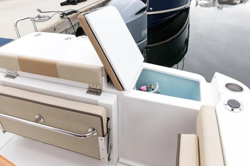 Slide: The Image of Manufacturer Provided Image: 2021 Ranger Tugs R-27 boat with open storage compartment and seating area. - 9