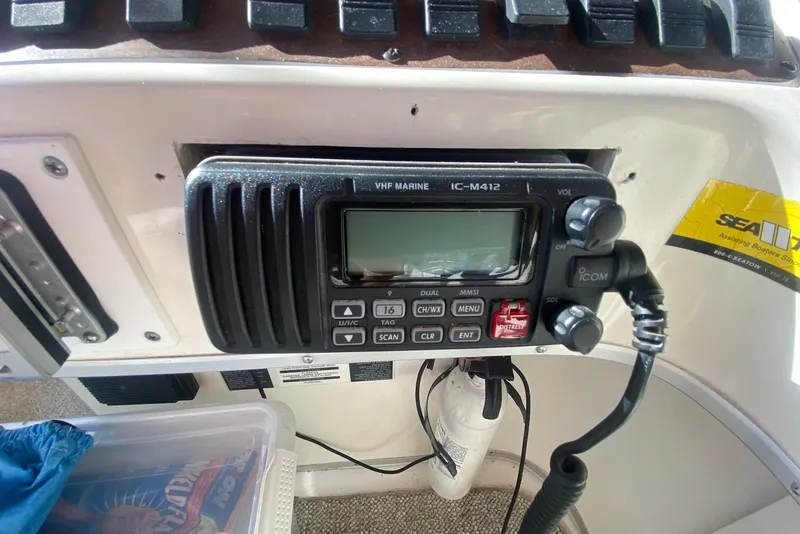Slide: The Image of VHF marine radio on 1996 Sea Ray 440 Express Bridge boat dashboard. - 16