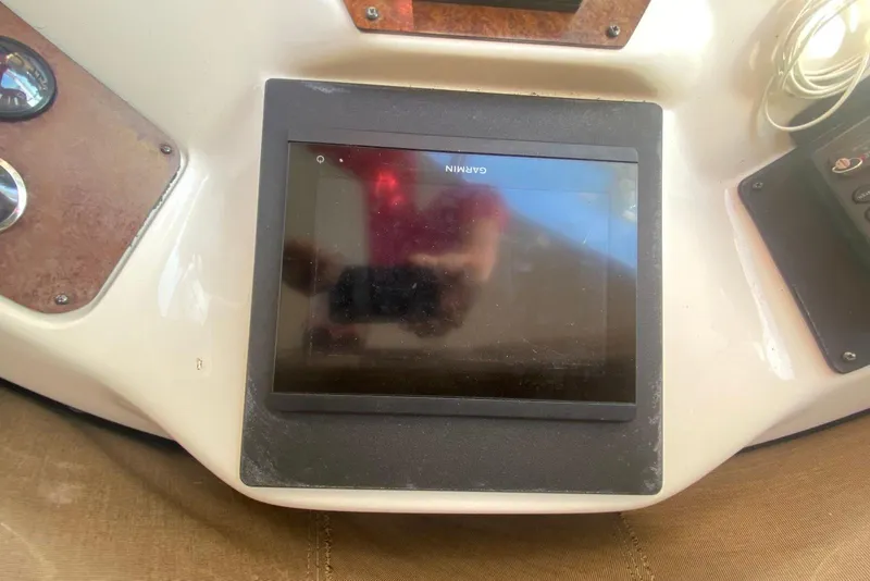 Slide: The Image of Garmin navigation display on 1996 Sea Ray 440 Express Bridge boat dashboard. - 18
