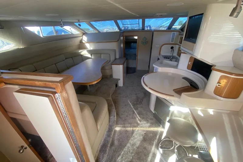 Slide: The Image of Luxurious interior of a 1996 Sea Ray 440 Express Bridge yacht with modern amenities. - 20