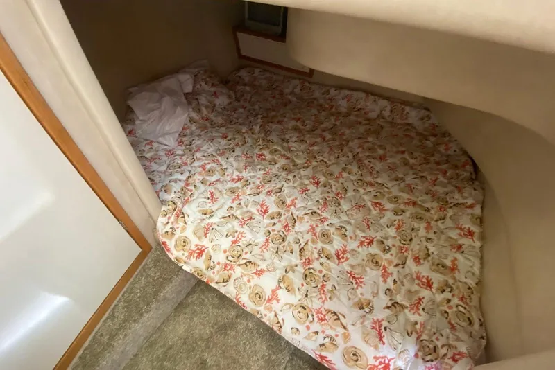 Slide: The Image of Cozy cabin bed with floral bedding in 1996 Sea Ray 440 Express Bridge yacht. - 33