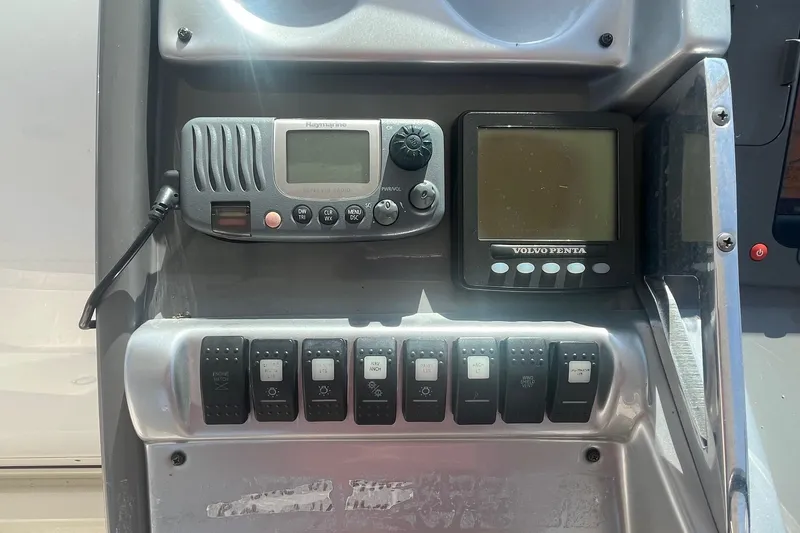 Slide: The Image of Control panel of a 2010 Monterey 400 Sport Yacht with radio and Volvo Penta display. - 10