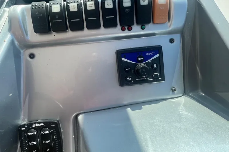 Slide: The Image of Control panel of a 2010 Monterey 400 Sport Yacht with switches and EVC system. - 12