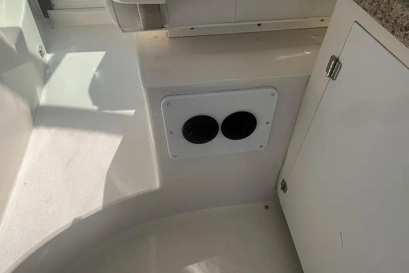 Slide: The Image of Interior of 2010 Monterey 400 Sport Yacht showing storage compartment and cup holders. - 18