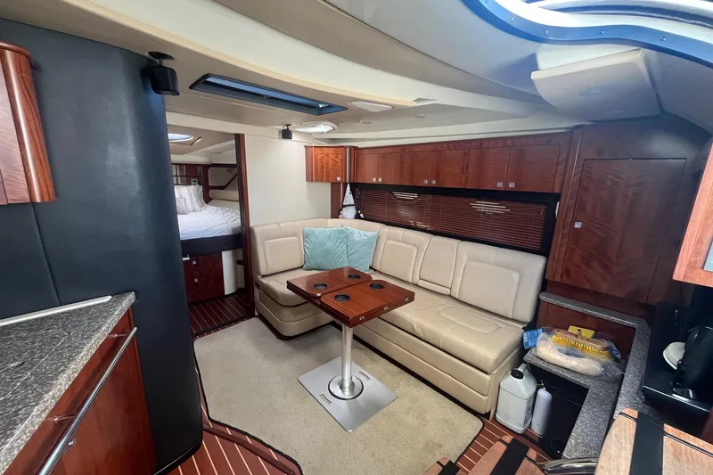 Slide: The Image of Luxurious interior of 2010 Monterey 400 Sport Yacht with leather seating and wooden cabinetry. - 22