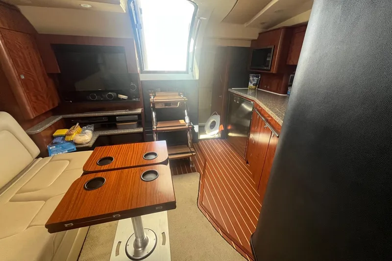 Slide: The Image of Interior of 2010 Monterey 400 Sport Yacht with wood accents and modern amenities. - 27