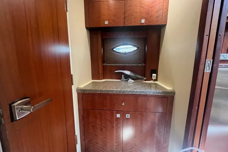 Slide: The Image of Interior of 2010 Monterey 400 Sport Yacht with wooden cabinetry and countertop. - 29