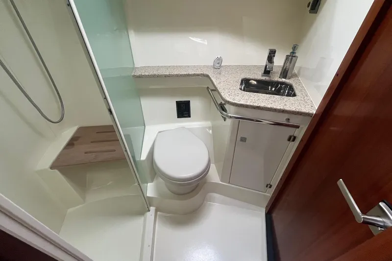 Slide: The Image of Bathroom interior of 2010 Monterey 400 Sport Yacht with shower, toilet, and sink. - 30