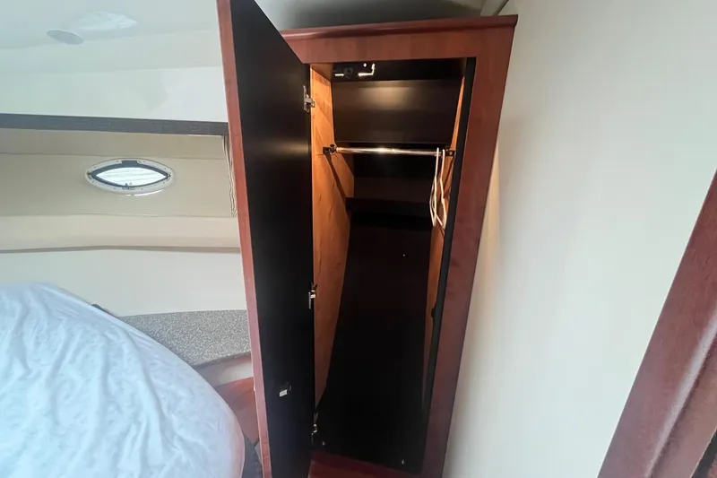 Slide: The Image of Open closet in 2010 Monterey 400 Sport Yacht cabin interior. - 32