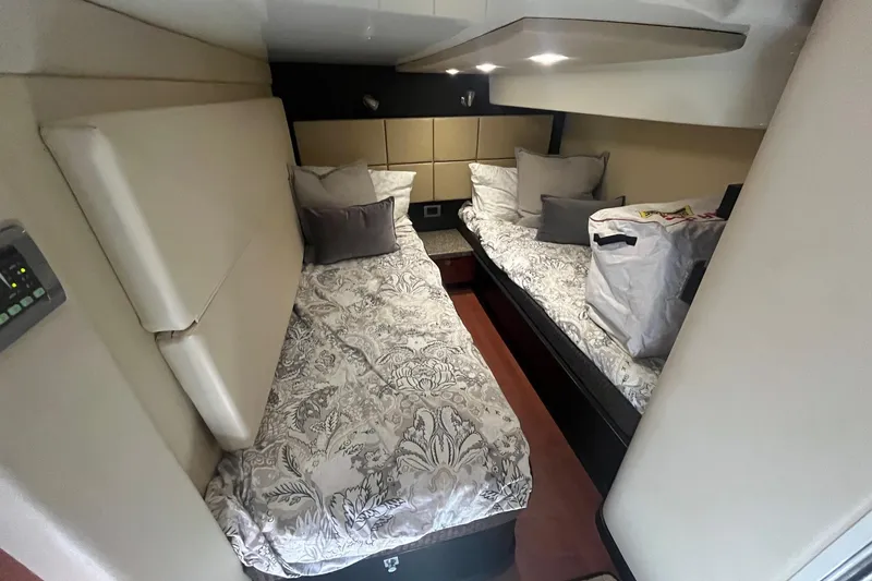 Slide: The Image of 2010 Monterey 400 Sport Yacht cabin with twin beds and modern decor. - 33