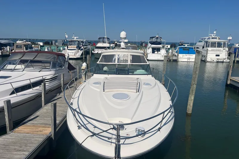 Slide: The Image of 2010 Monterey 400 Sport Yacht docked at a marina under clear blue skies. - 3
