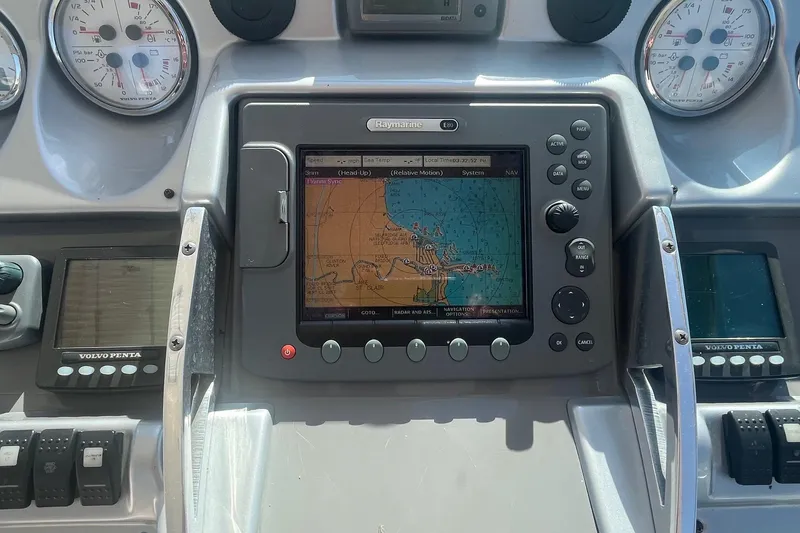 Slide: The Image of Dashboard of a 2010 Monterey 400 Sport Yacht with navigation system and gauges. - 9