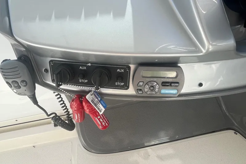 Slide: The Image of Control panel of a 2010 Monterey 400 Sport Yacht with radio and auxiliary switches. - 11