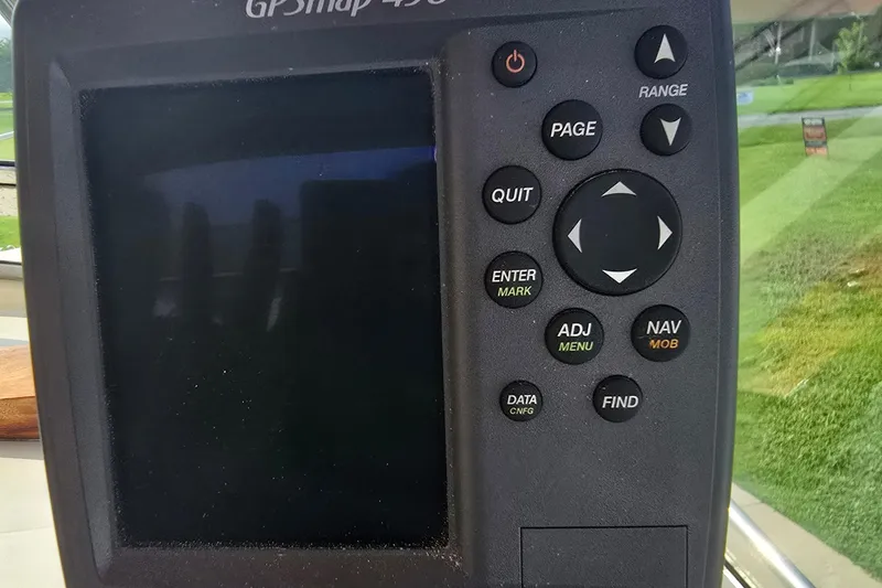 Slide: The Image of GPS navigation device on a 1989 Hinterhoeller Limestone boat dashboard. - 15