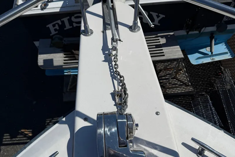 Slide: The Image of Bow of 1996 Grady-White Marlin 300 with anchor chain and winch. - 12