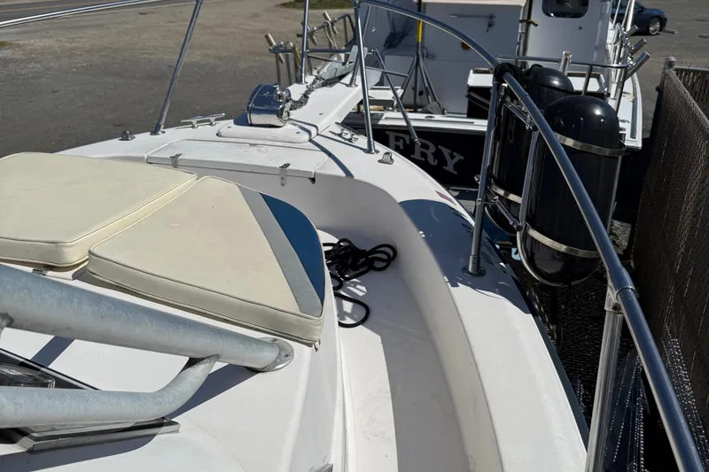 Slide: The Image of 1996 Grady-White Marlin 300 boat deck with seating and railing. - 14