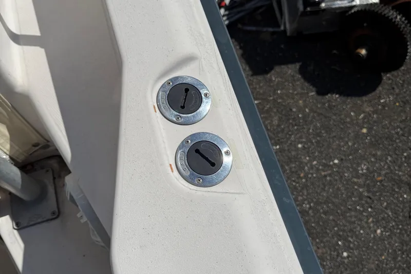 Slide: The Image of Fuel caps on a 1996 Grady-White Marlin 300 boat deck. - 34