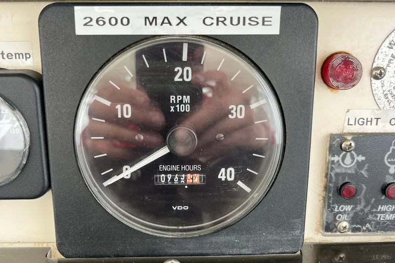 Slide: The Image of Close-up of Albin 32 Sportfisher 1989 tachometer showing RPM and engine hours. - 17