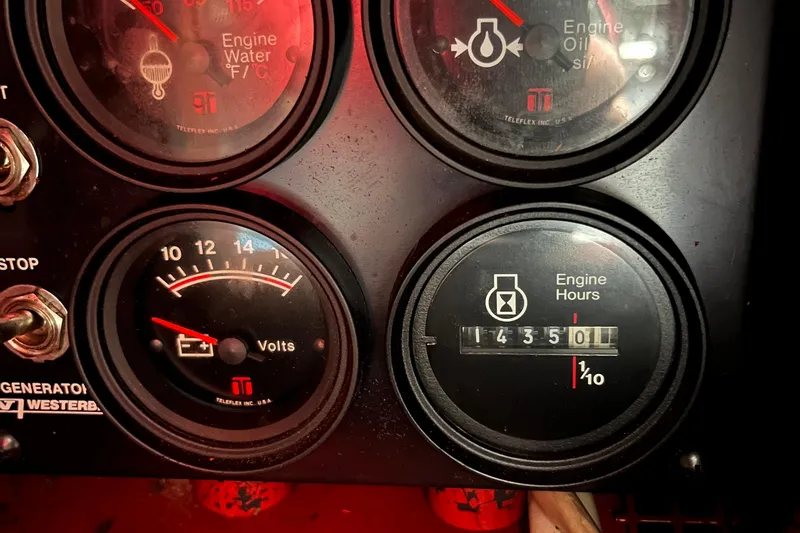 Slide: The Image of Close-up of 1989 Albin 32 Sportfisher gauges showing engine water, oil, volts, and hours. - 26