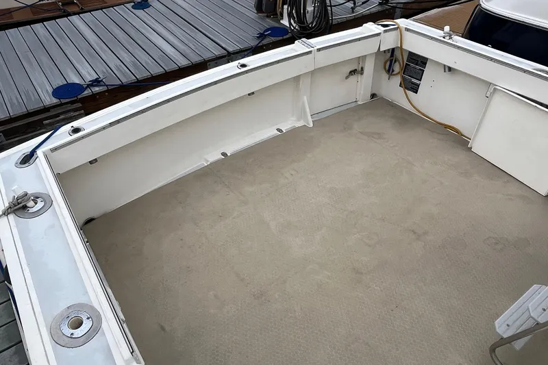 Slide: The Image of 1989 Albin 32 Sportfisher boat deck, spacious and clean, docked at marina. - 6