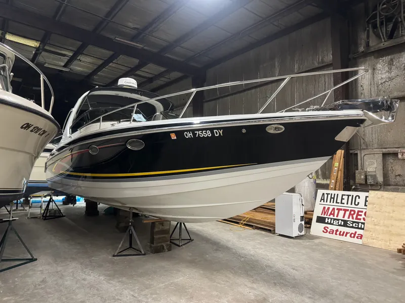 Slide: The Image of 2006 Formula 330 SunSport boat in storage facility. - 10