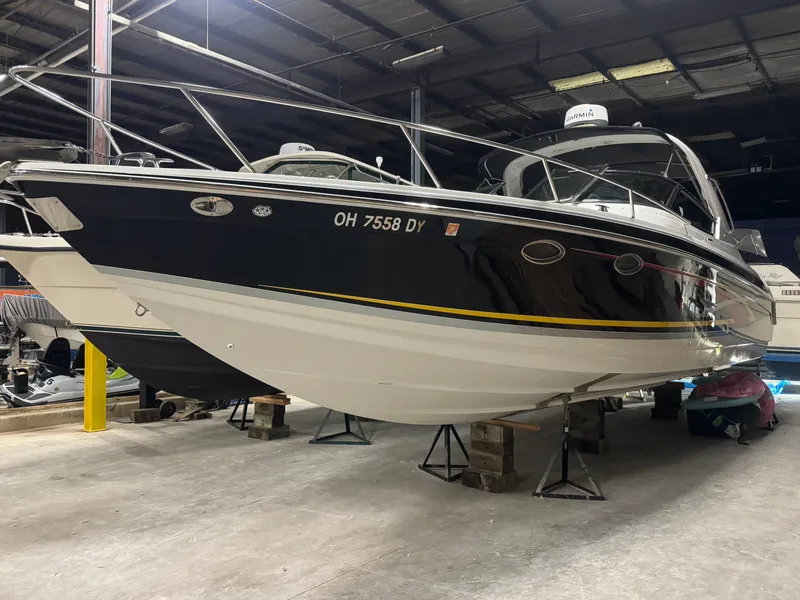 Slide: The Image of 2006 Formula 330 SunSport boat elevated in storage facility. - 11