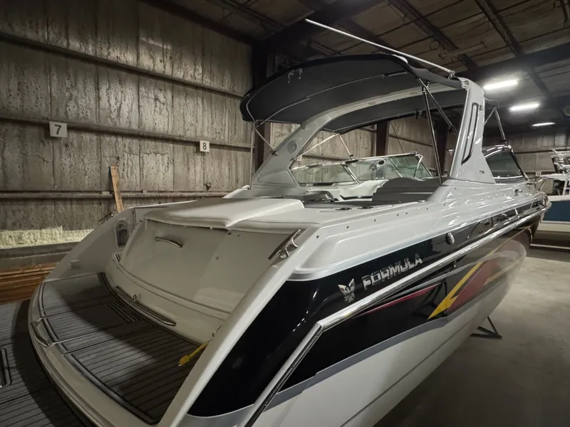 Slide: The Image of 2006 Formula 330 SunSport boat in storage facility. - 13