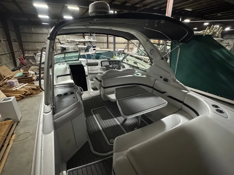 Slide: The Image of Interior of a 2006 Formula 330 SunSport boat in a storage warehouse. - 14