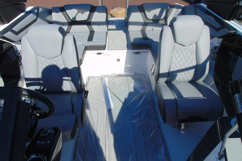 Slide: The Image of 2026 Yamaha Boats 222XD interior with modern gray seating and sleek design. - 14