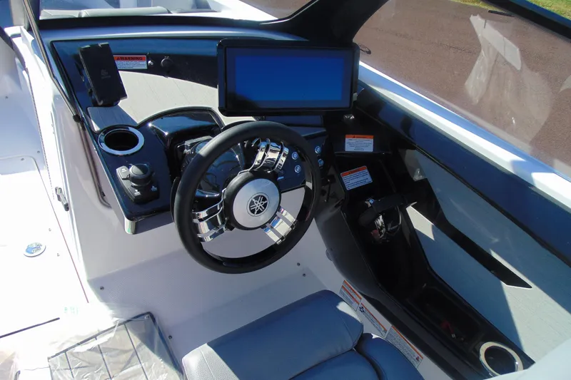 Slide: The Image of 2026 Yamaha Boats 222XD dashboard with steering wheel, touchscreen, and controls. - 9