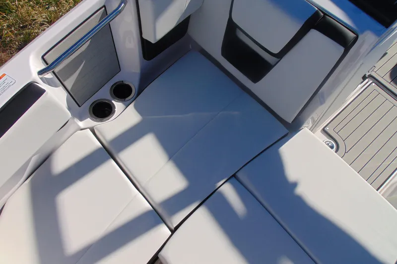 Slide: The Image of 2026 Yamaha Boats 222S interior seating with cup holders and sleek design. - 17