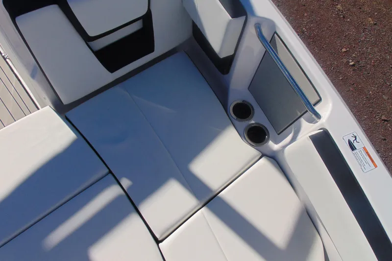 Slide: The Image of 2026 Yamaha Boats 222S interior seating with cup holders and sleek design. - 18