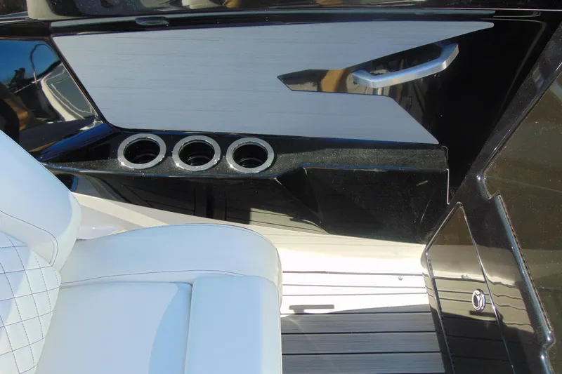 Slide: The Image of Interior of 2026 Yamaha Boats 222S featuring sleek seating and cup holders. - 20