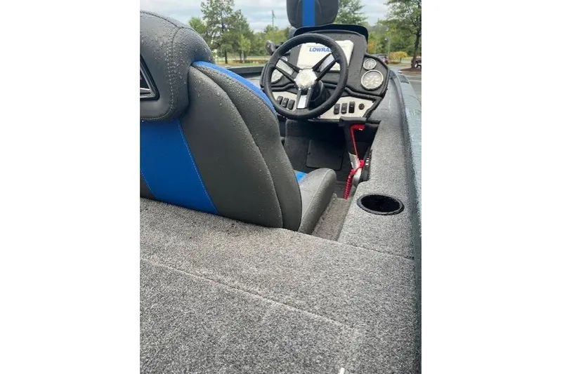 Slide: The Image of 2025 Ranger RT188P boat interior with steering wheel and blue-gray seating. - 5