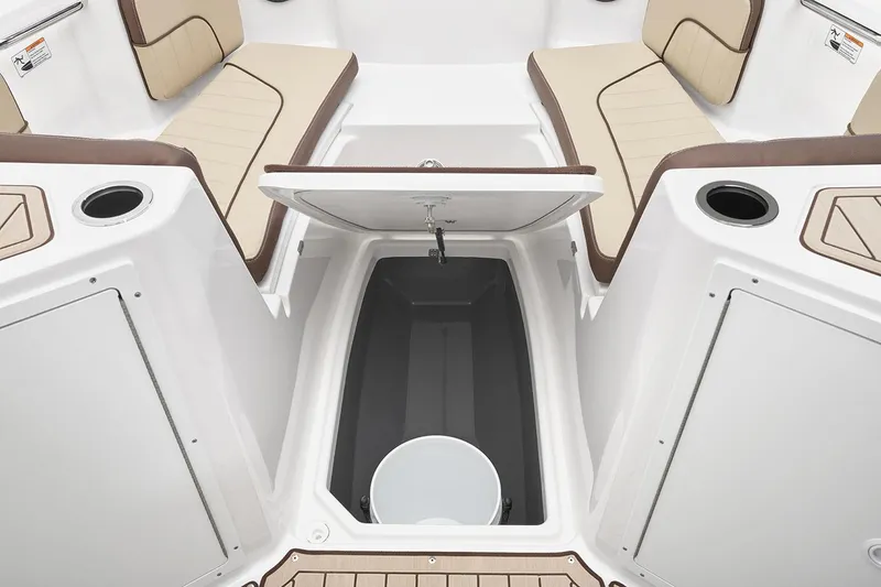 Slide: The Image of Manufacturer Provided Image: 2026 Yamaha Boats 222 FSH Sport E interior with storage compartment and seating. - 7