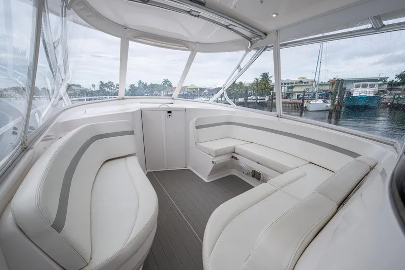 Slide: The Image of 2019 Intrepid 407 Cuddy interior with sleek white seating and panoramic windows. - 28