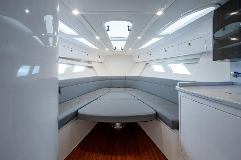 Slide: The Image of Luxurious interior of 2019 Intrepid 407 Cuddy boat with modern seating and cabinetry. - 33