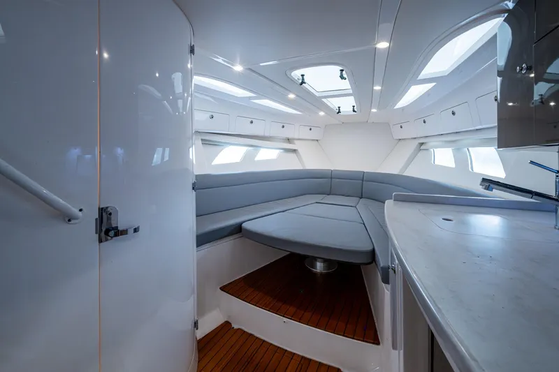 Slide: The Image of Interior of 2019 Intrepid 407 Cuddy boat with modern seating and skylights. - 35