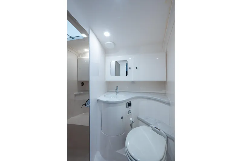 Slide: The Image of 2019 Intrepid 407 Cuddy boat bathroom with modern fixtures and sleek design. - 40