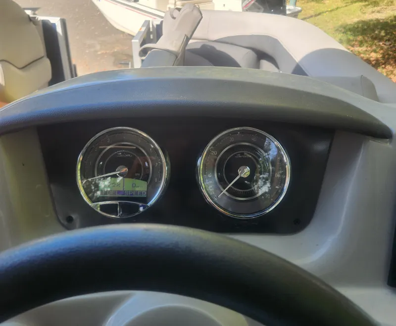 Slide: The Image of 2025 Barletta ARIA 22UC pontoon boat on trailer outdoors. - 15