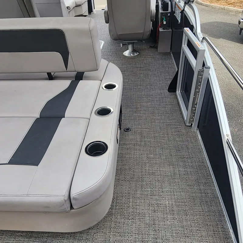 Slide: The Image of Interior of 2025 Barletta ARIA 22UC with gray seating and cup holders. - 21