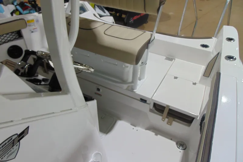 Slide: The Image of 2026 Yamaha Boats 222 FSH Sport E interior with seating and control panel. - 12