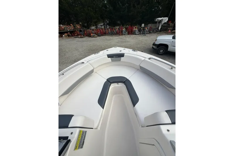 Slide: The Image of 2021 Robalo R227 Dual Console boat interior with white and gray seating. - 20